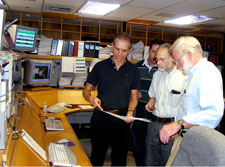 Members of the GP-B Dewar Team examine telemetry data from the dewar confirming that the helium was beginning to run out.