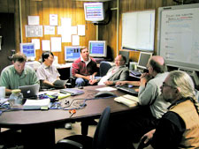 GP-B scientists and engineers work through the cause and recommend a solution to a spececraft anomaly in the GP-B Anomaly Room..